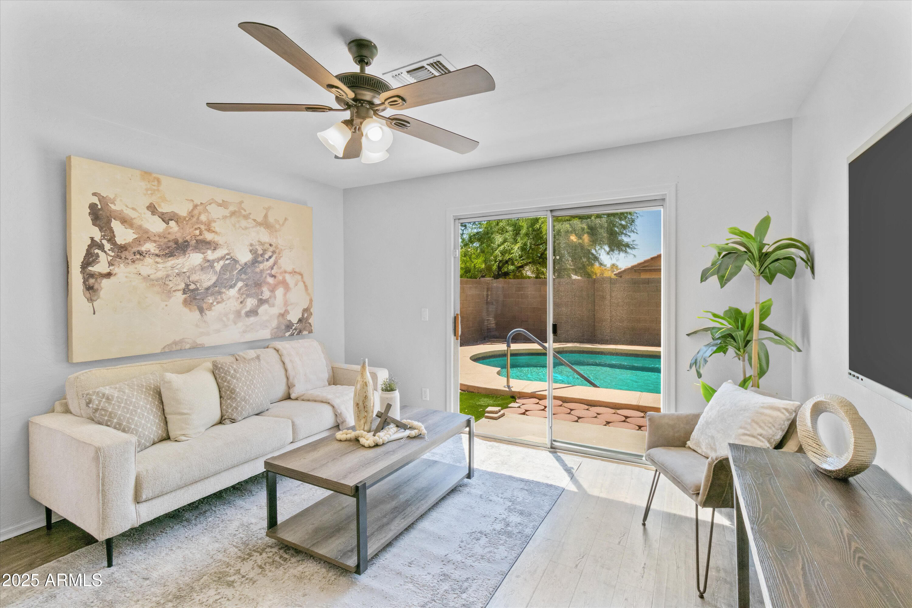 11921 West Bloomfield Road El Mirage, AZ 85335 - Photo 10 of 24 a living room with furniture and a large window