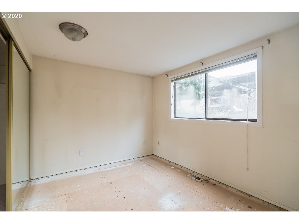 5620 Southwest Riverside Lane Portland, OR 97239 - Photo 17 of 25 a view of an empty room with a window
