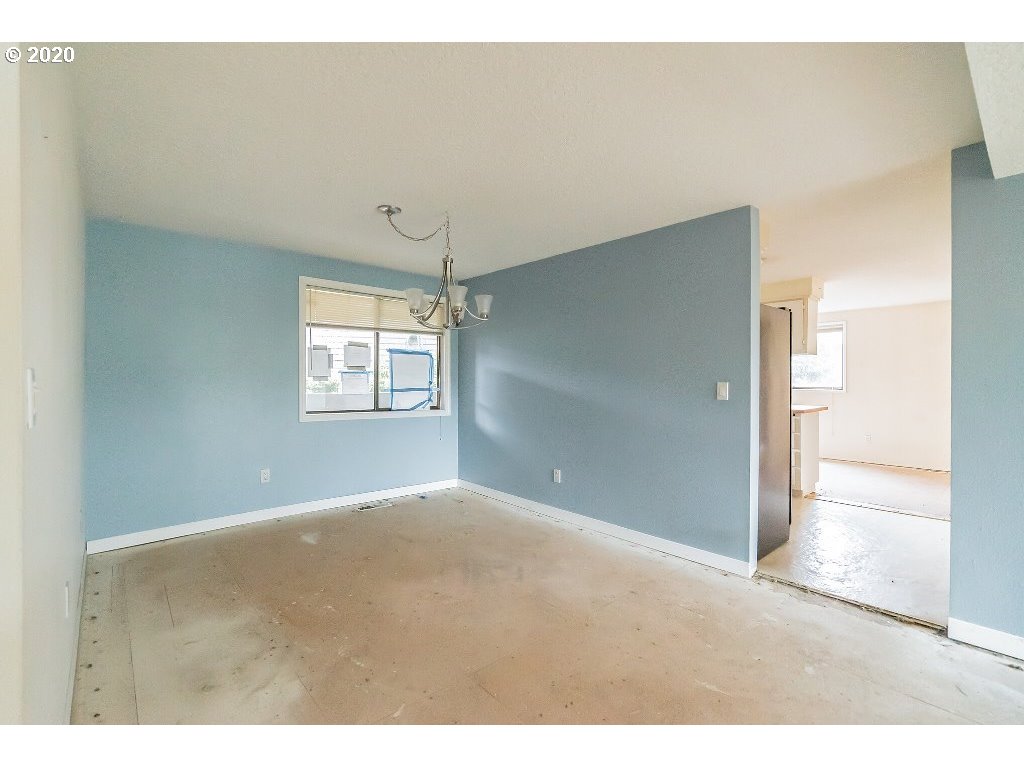 5620 Southwest Riverside Lane Portland, OR 97239 - Photo 18 of 25 a view of empty room with windows