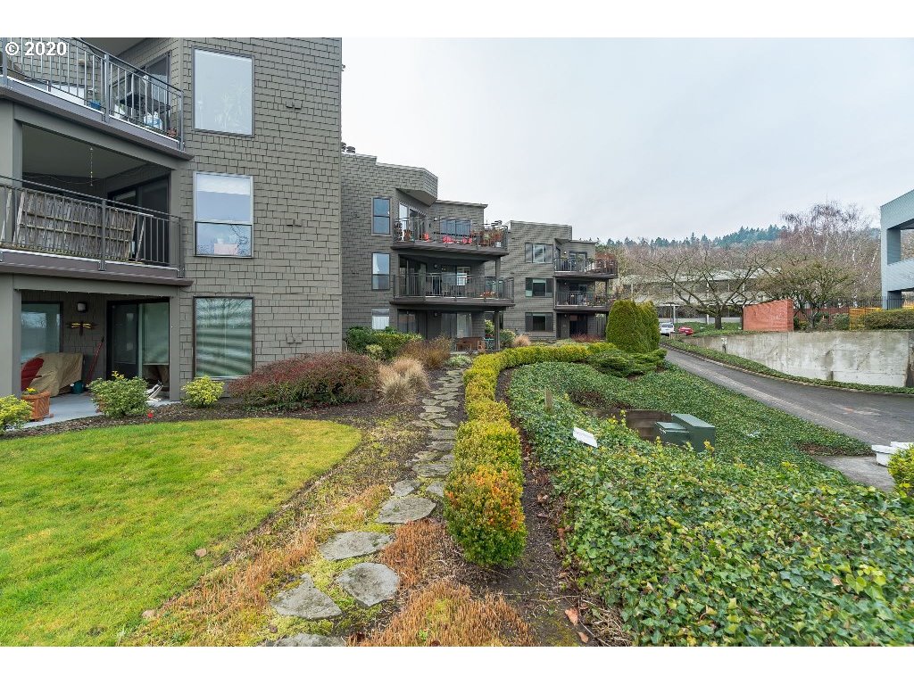 5620 Southwest Riverside Lane Portland, OR 97239 - Photo 2 of 25 a swimming pool with outdoor seating and yard
