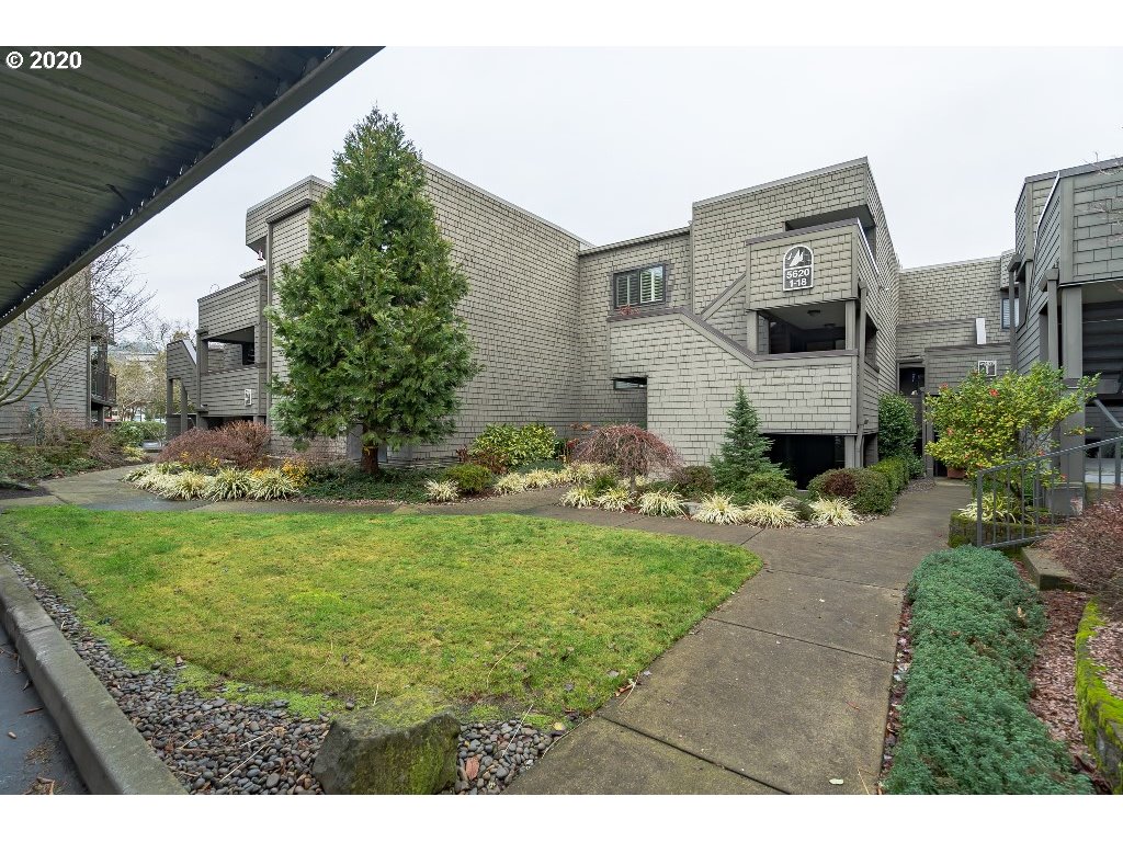 5620 Southwest Riverside Lane Portland, OR 97239 - Photo 9 of 25 a backyard of a house with plants and large tree