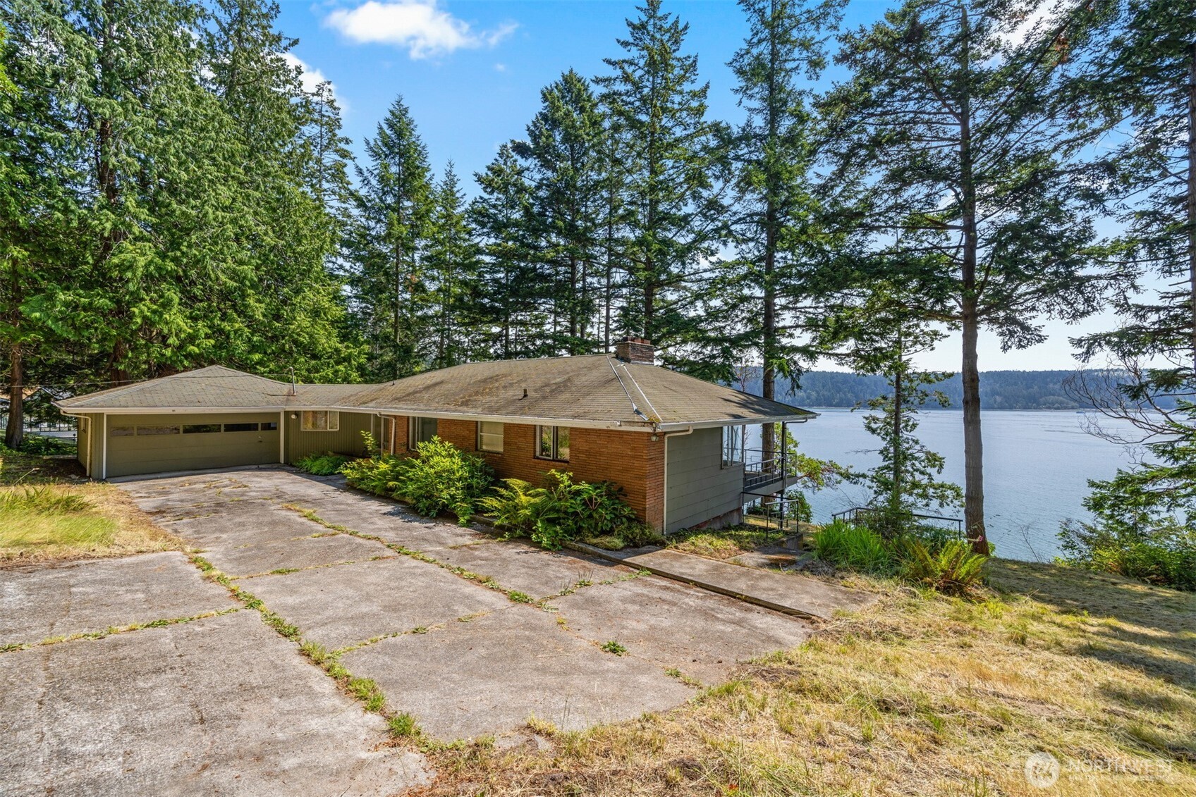 5318 Quiet Cove Road Anacortes, WA 98221 - Photo 15 of 32 a front view of a house with garden