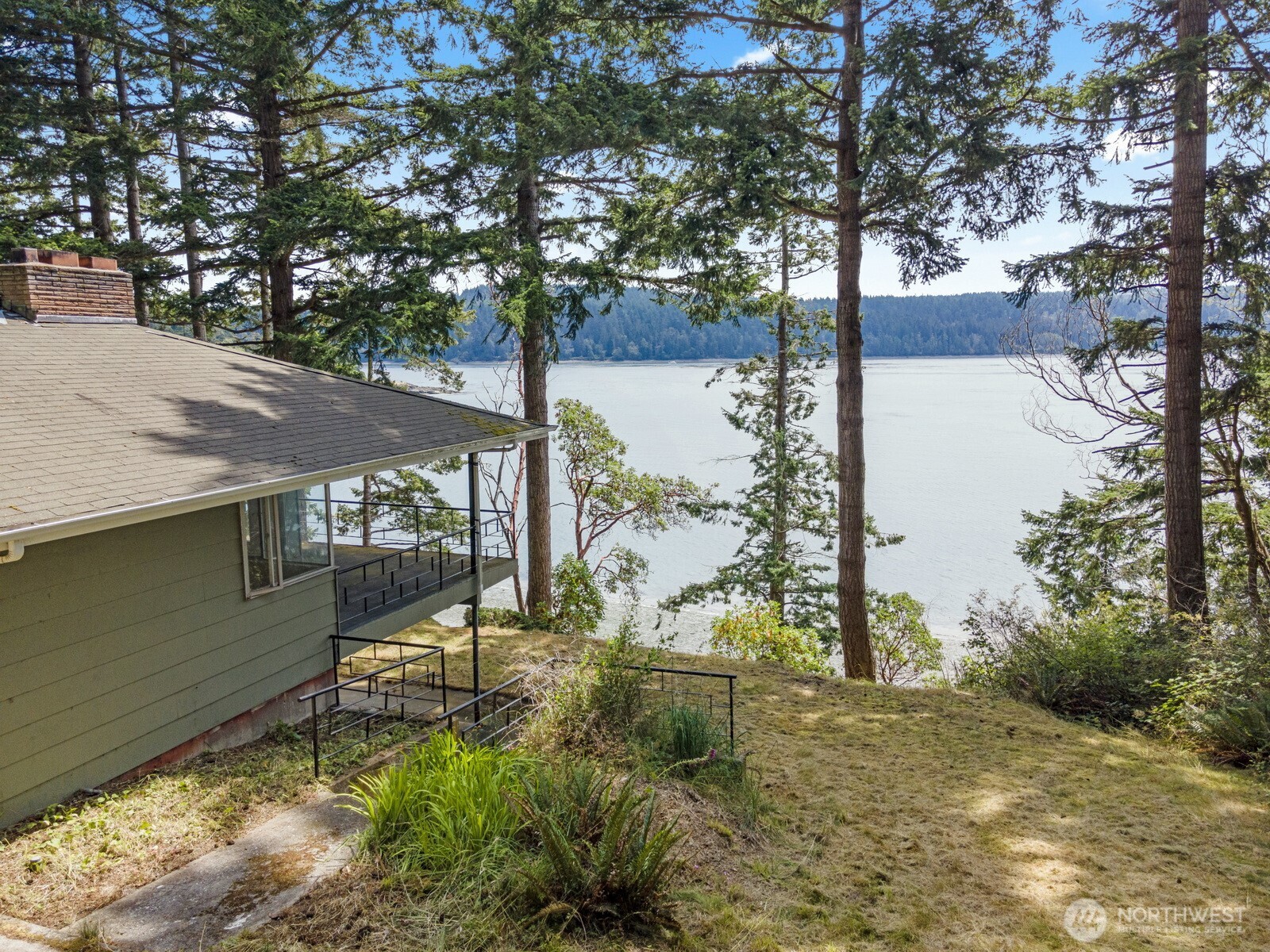 5318 Quiet Cove Road Anacortes, WA 98221 - Photo 16 of 32 a backyard of a house with lots of green space