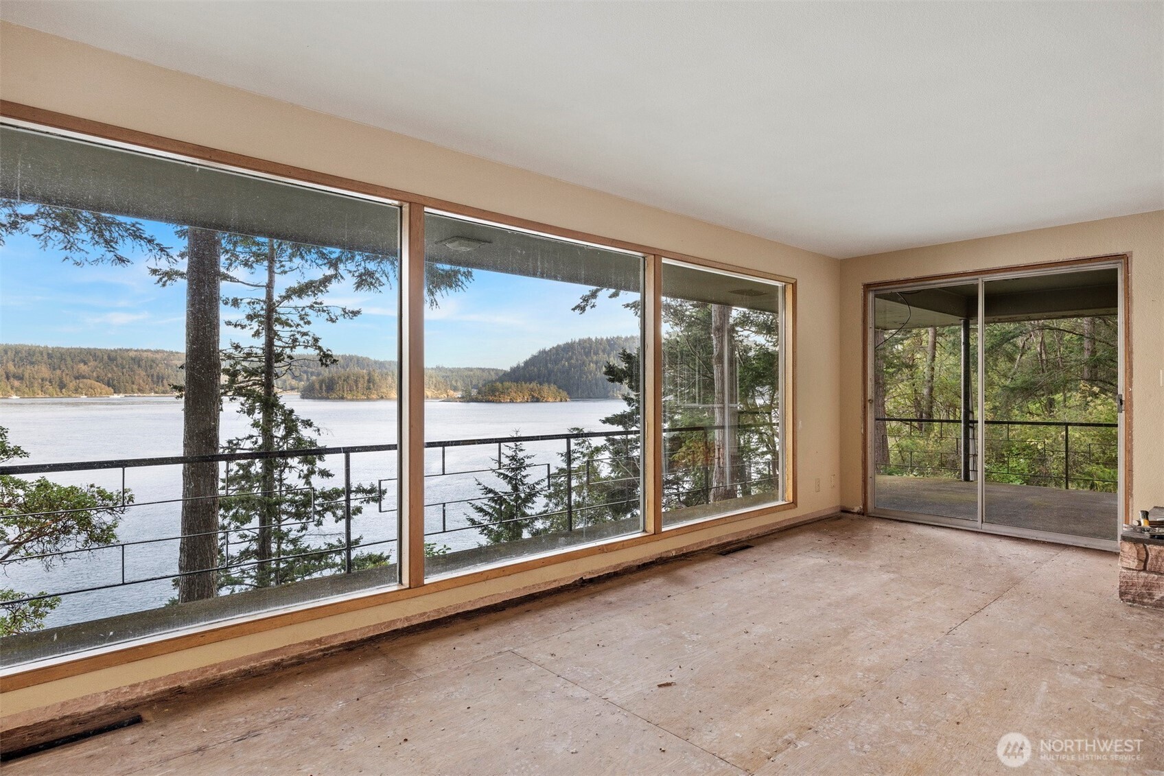 5318 Quiet Cove Road Anacortes, WA 98221 - Photo 23 of 32 a view of a room with sliding glass door