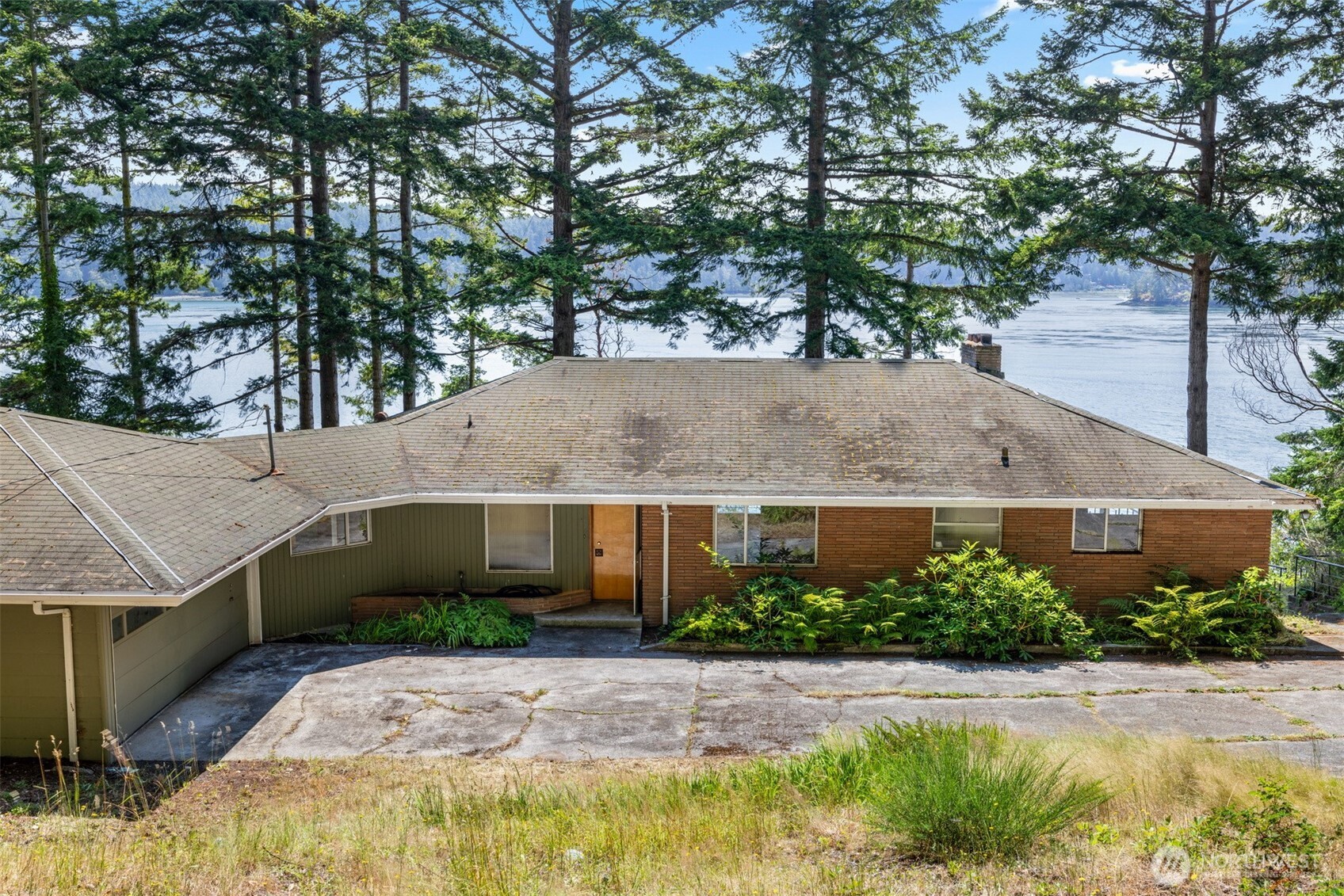5318 Quiet Cove Road Anacortes, WA 98221 - Photo 32 of 32 a front view of a house with garden