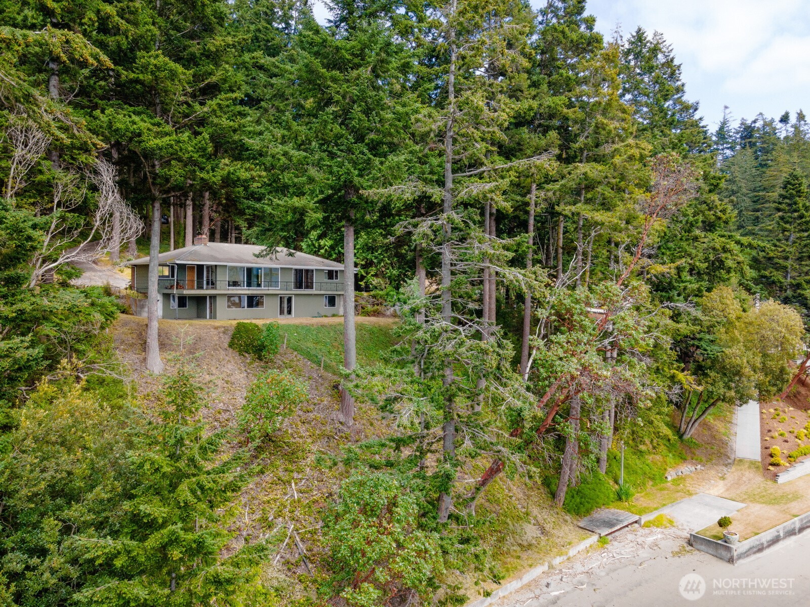 5318 Quiet Cove Road Anacortes, WA 98221 - Photo 4 of 32 front view of a house with a yard