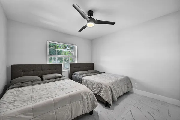 a view of a patio with a table and chairs in patio
