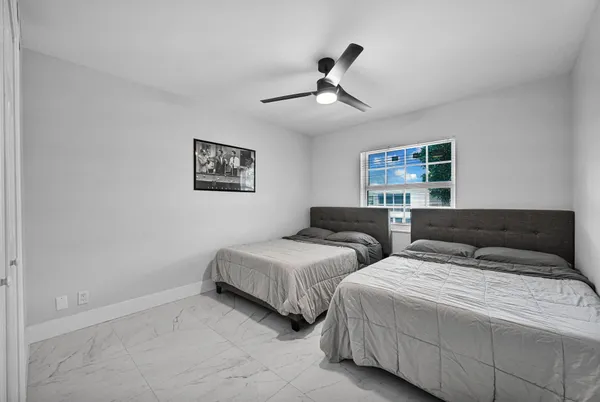 a view of a city from a balcony with furniture