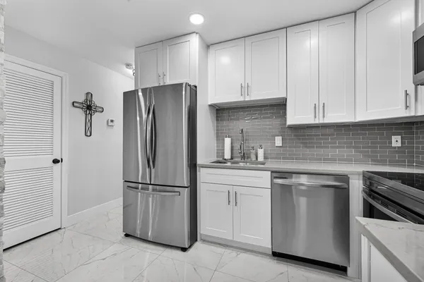 a view of two chairs in the balcony