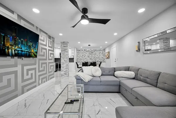 a white toilet sitting next to a bathroom sink