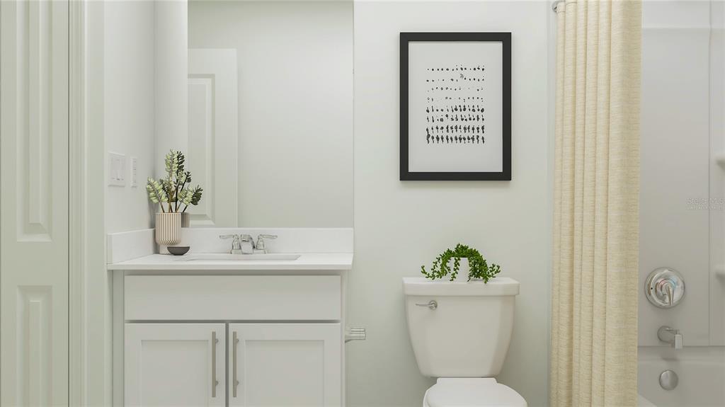 2170 Lasso Loop Eagle Lake, FL 33839 - Photo 13 of 30 a bathroom with a toilet a sink and a mirror