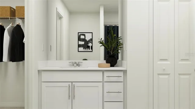 a white toilet sitting next to a bathroom sink