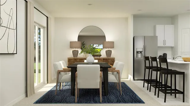 a view of a dining room with furniture and a rug