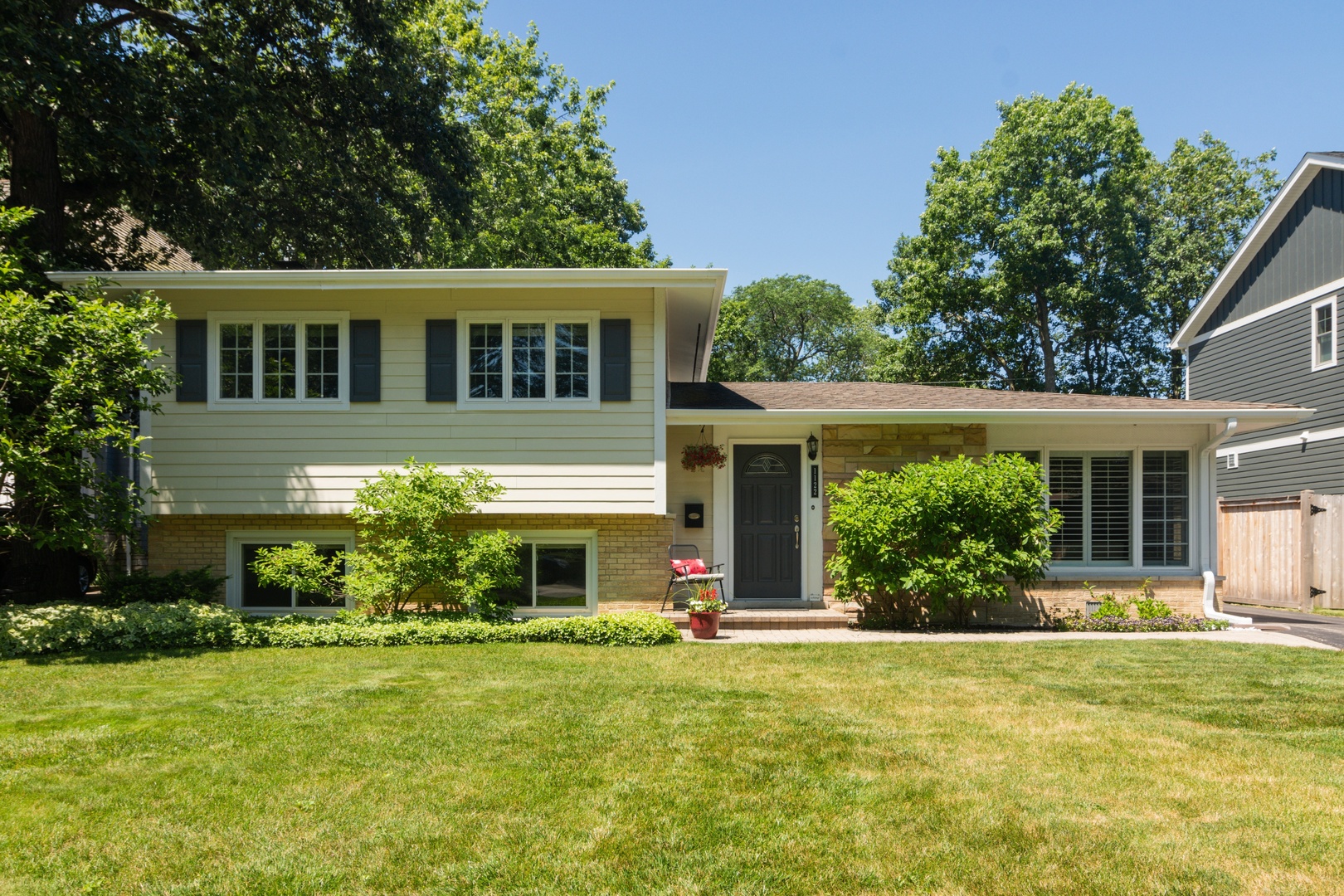 1122 Kenton Road Deerfield, IL 60015 - Photo 1 of 10 a front view of house with an outdoor space and seating