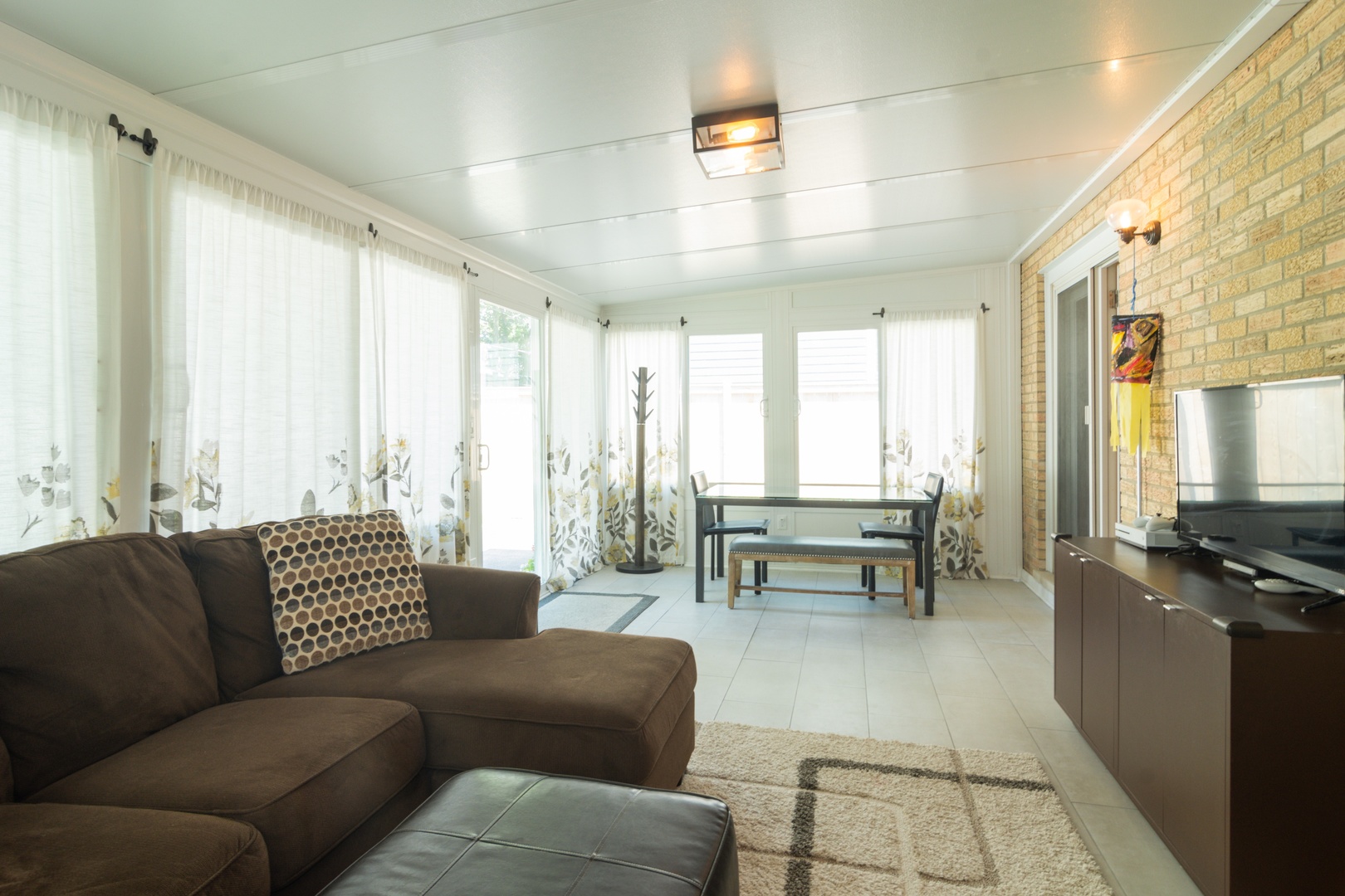 1122 Kenton Road Deerfield, IL 60015 - Photo 5 of 10 a living room with furniture and large windows