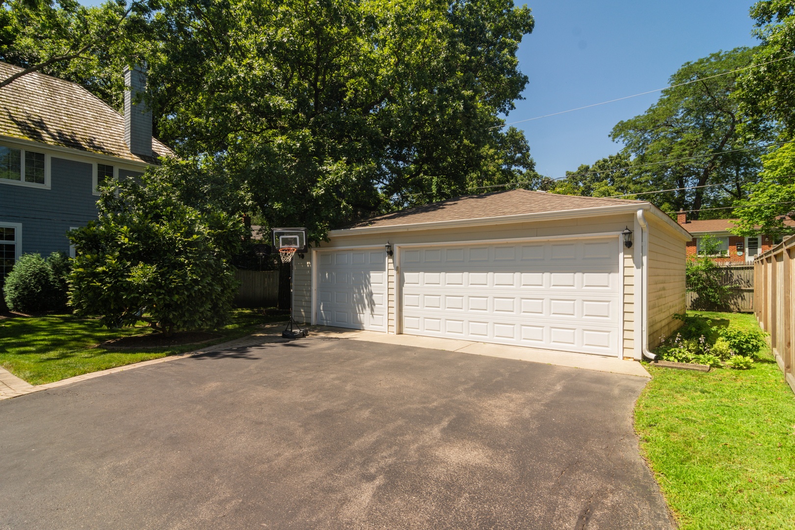 1122 Kenton Road Deerfield, IL 60015 - Photo 9 of 10 a view of a house with garage and small yard