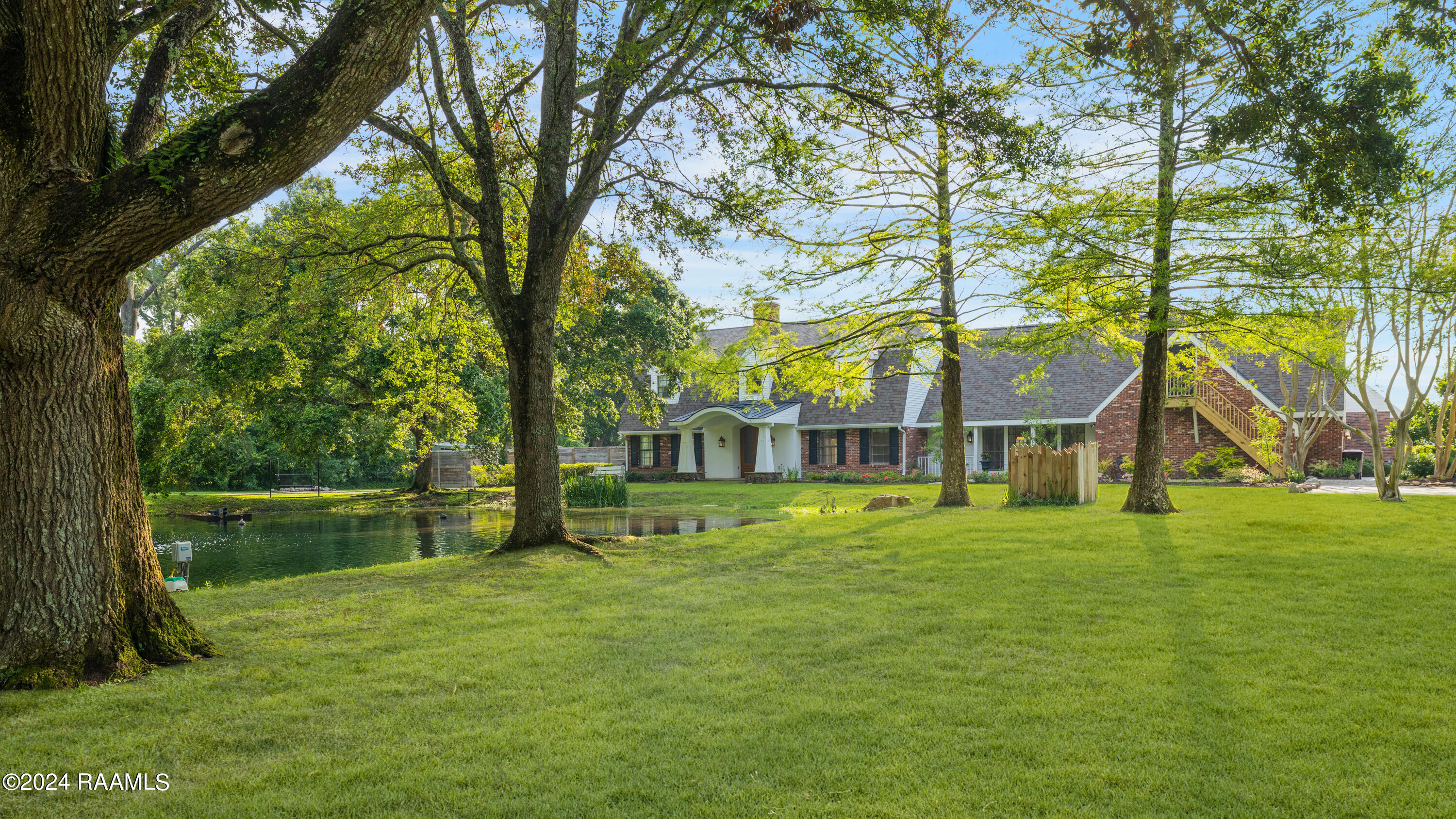 Frontage View With Oaks and Cypress