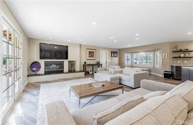 a bath tub sitting in a bathroom next to a window
