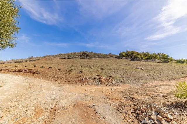 a view of a road with a building in the background