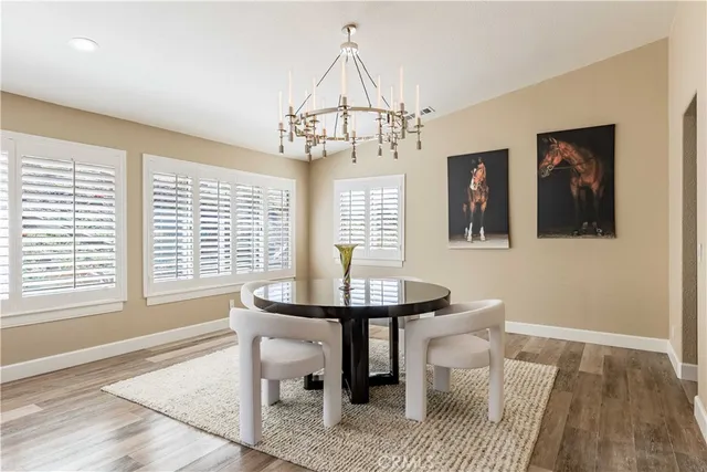 a living room with furniture a window and a table
