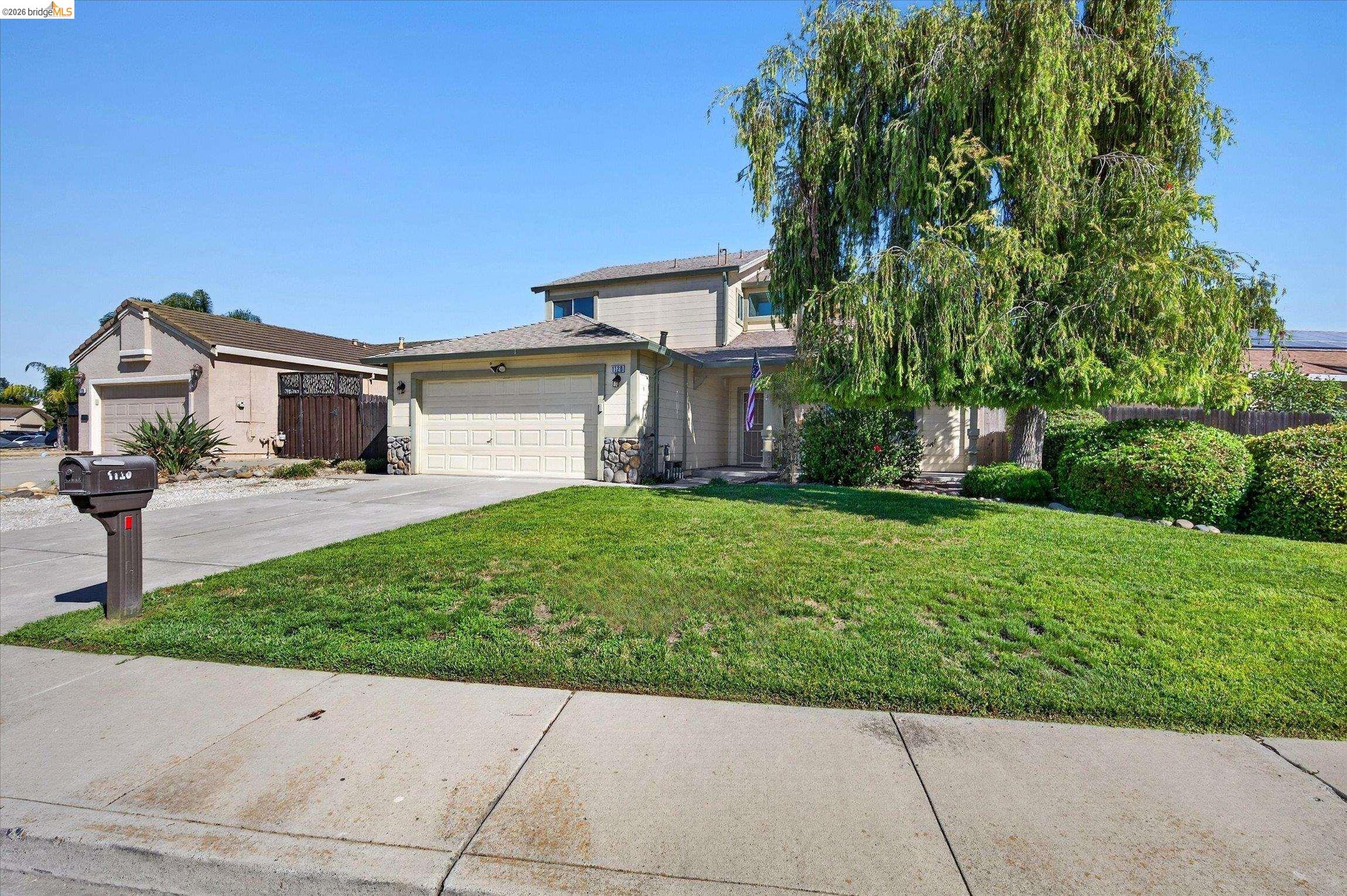 1120 Deerpark Road Oakley, CA 94561 - Photo 2 of 30 Two-story residence featuring an attached garage, stone facade accents, and a covered front entry