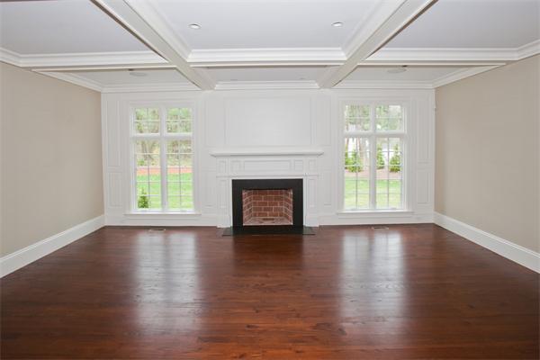 29 Cornell Road Wellesley, MA 02482 - Photo 11 of 23 an empty room with wooden floor fireplace and windows