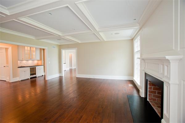 29 Cornell Road Wellesley, MA 02482 - Photo 12 of 23 a view of an empty room with wooden floor fireplace and a window
