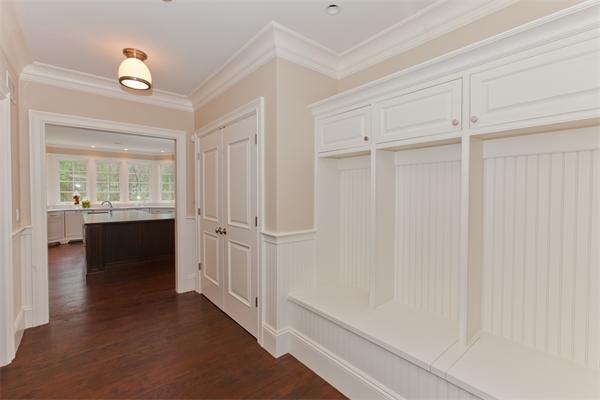 29 Cornell Road Wellesley, MA 02482 - Photo 21 of 23 a view of a hallway with wooden floor and a cabinet