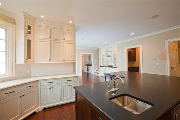 29 Cornell Road Wellesley, MA 02482 - Photo 6 of 23 a kitchen with granite countertop a sink a stove and cabinets