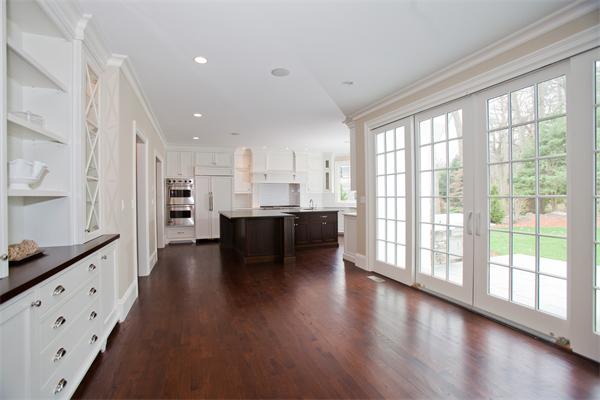 29 Cornell Road Wellesley, MA 02482 - Photo 10 of 23 a living room with stainless steel appliances kitchen island wooden floor and large windows