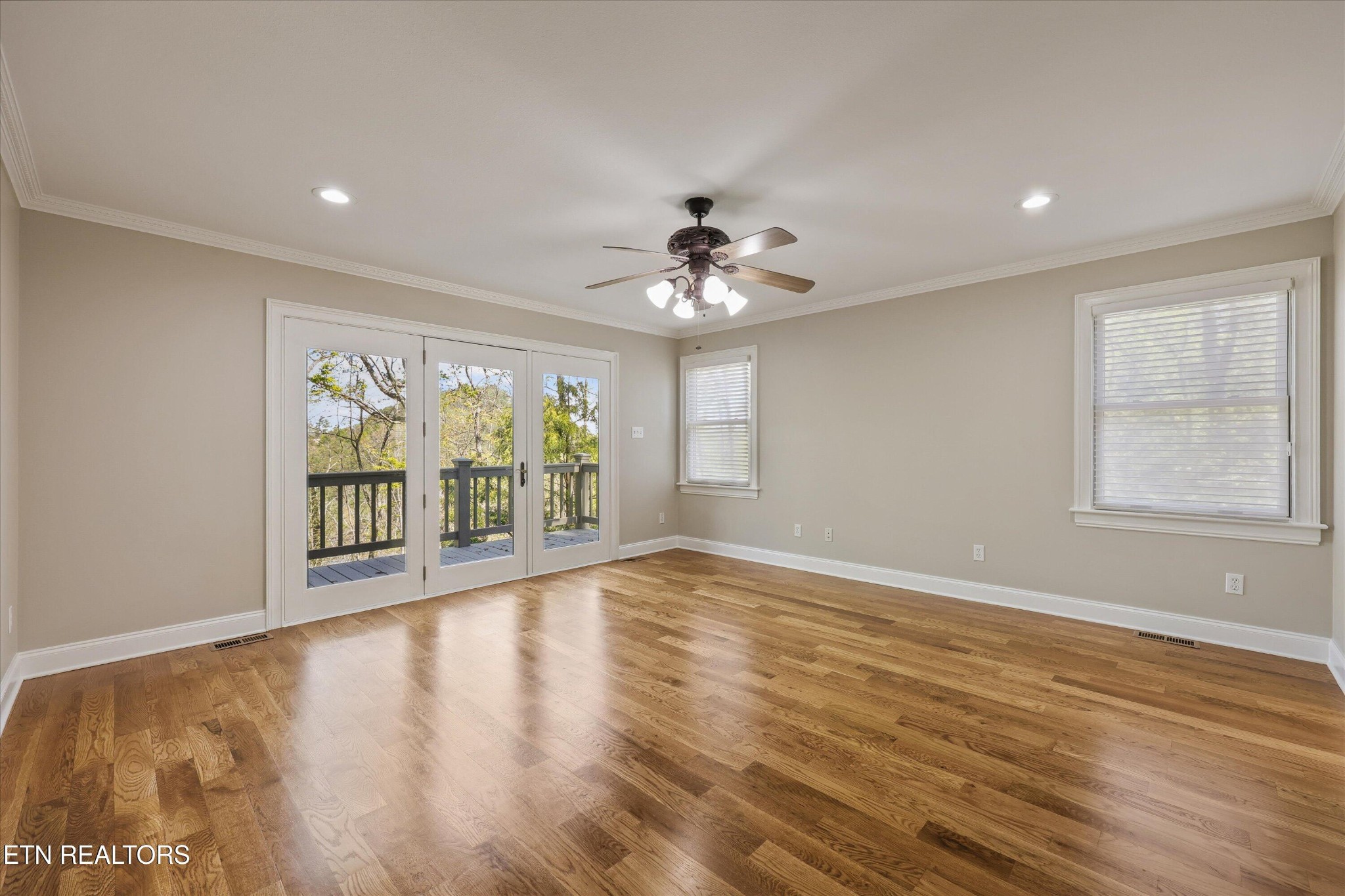 865 Stonegate Way Townsend, TN 37882 - Photo 12 of 60 a view of an empty room with wooden floor and a window