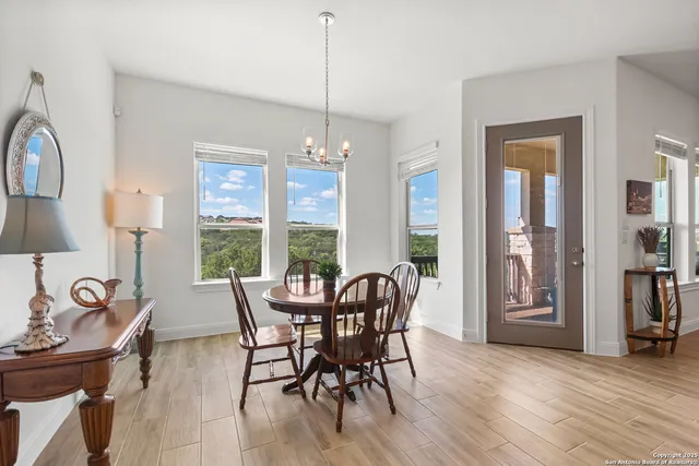 a view of a dining room with furniture window and outside view