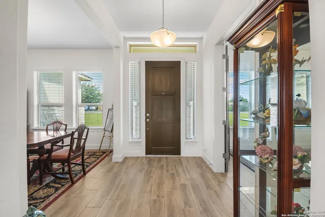 a view of a livingroom with furniture and front door