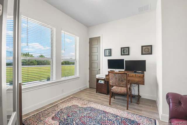 a workspace with furniture and a window