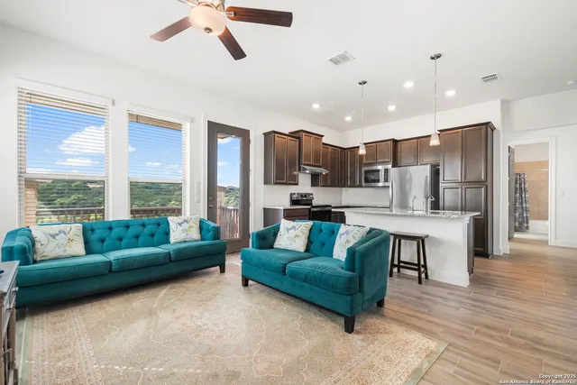 a living room with furniture and a window