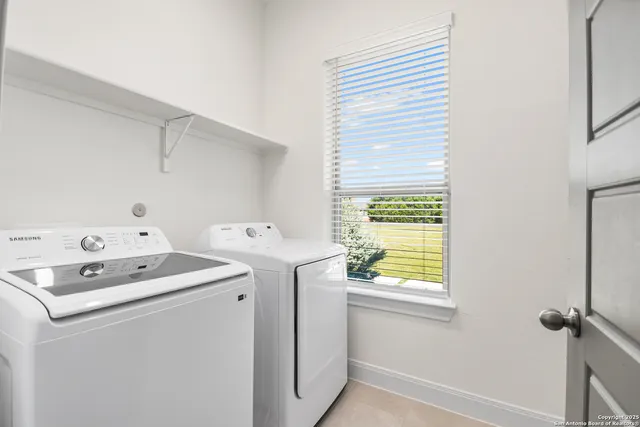 a bathroom with a granite countertop sink mirror toilet and bathtub