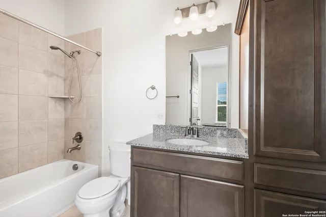 a bedroom with a bed table and window