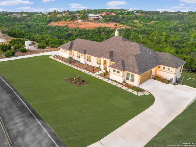 an aerial view of residential house with outdoor space