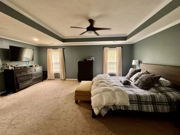 a view of living room with furniture and wooden floor