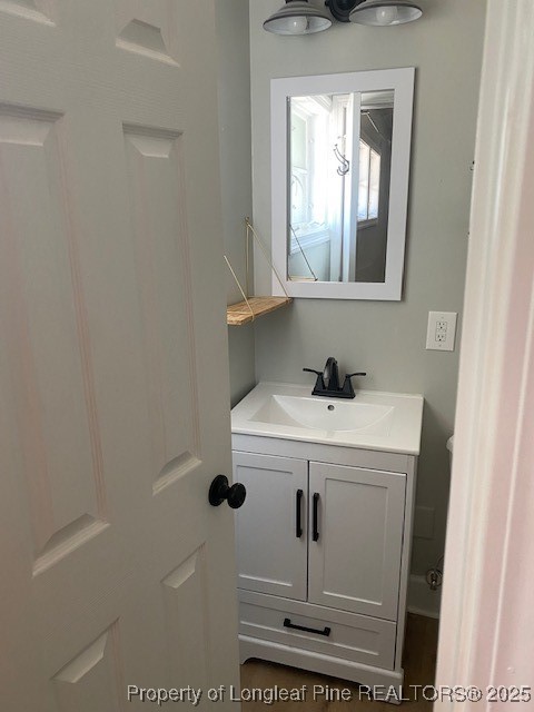 217 Bethune Street, Unit B Fayetteville, NC 28305 - Photo 11 of 13 a bathroom with a sink and a mirror