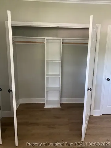 a view of an empty walk in closet