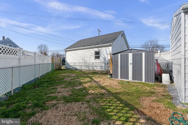 a backyard of a house with yard and seating space