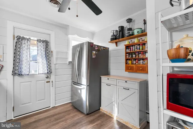 a kitchen with stainless steel appliances a stove a sink and a refrigerator