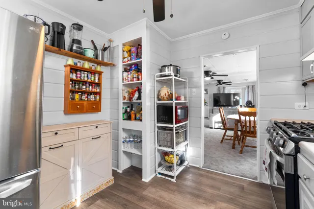 a view of a dining room with furniture and a window