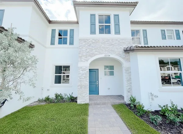 front view of a house with a yard