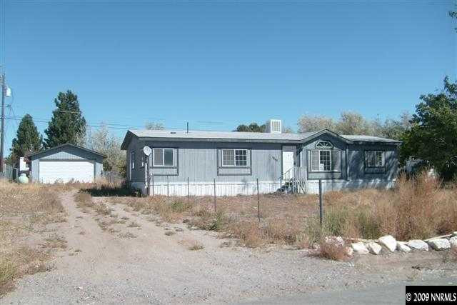 3840 Hummingbird Drive Reno, NV 89508 - Photo 1 of 9 a front view of a house with a yard