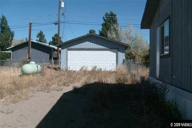 3840 Hummingbird Drive Reno, NV 89508 - Photo 8 of 9 a front view of a house with a yard