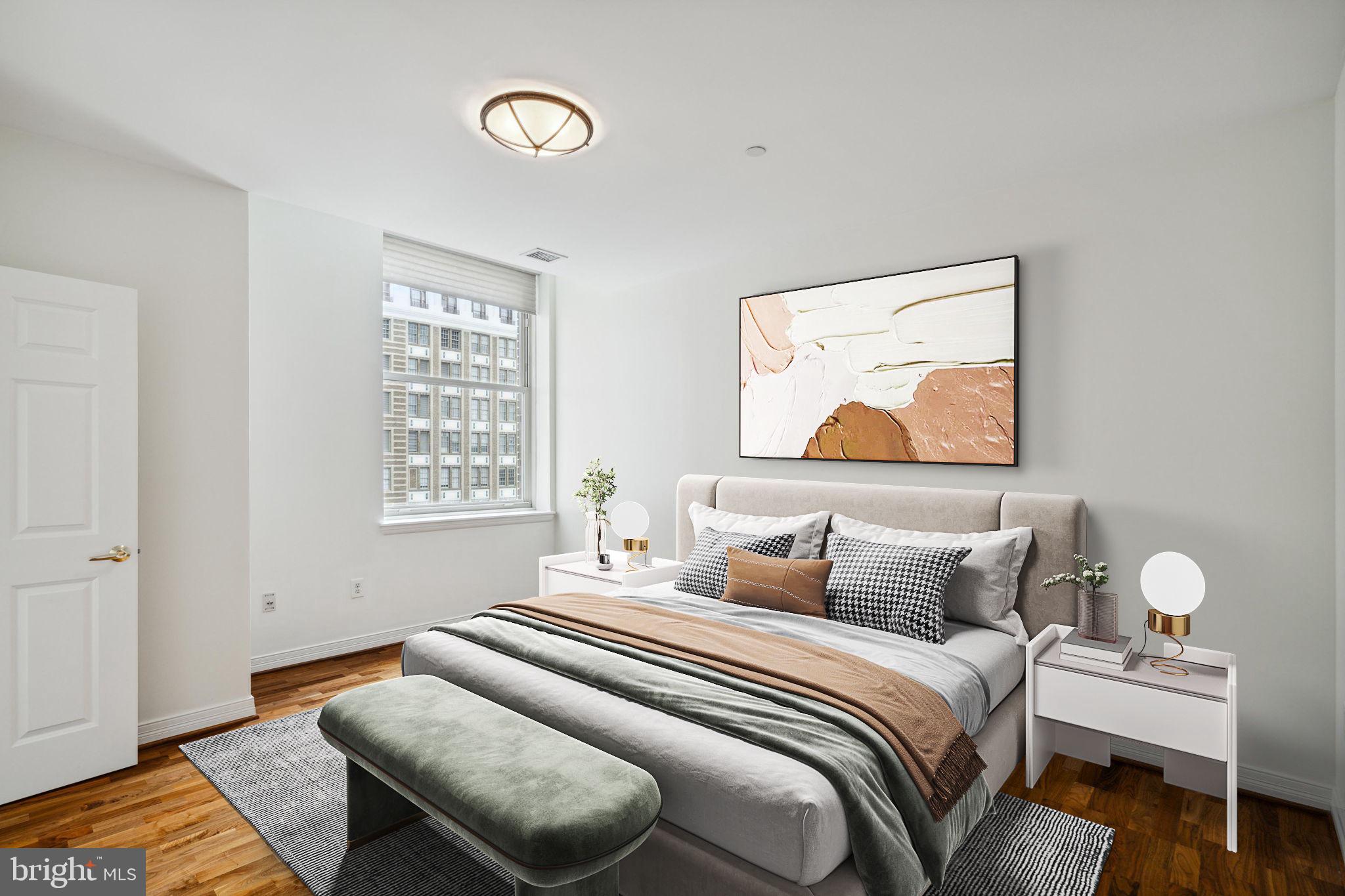 1600 Arch Street, Unit 1113 Philadelphia, PA 19103 - Photo 11 of 34 a bedroom with a bed and wooden floor