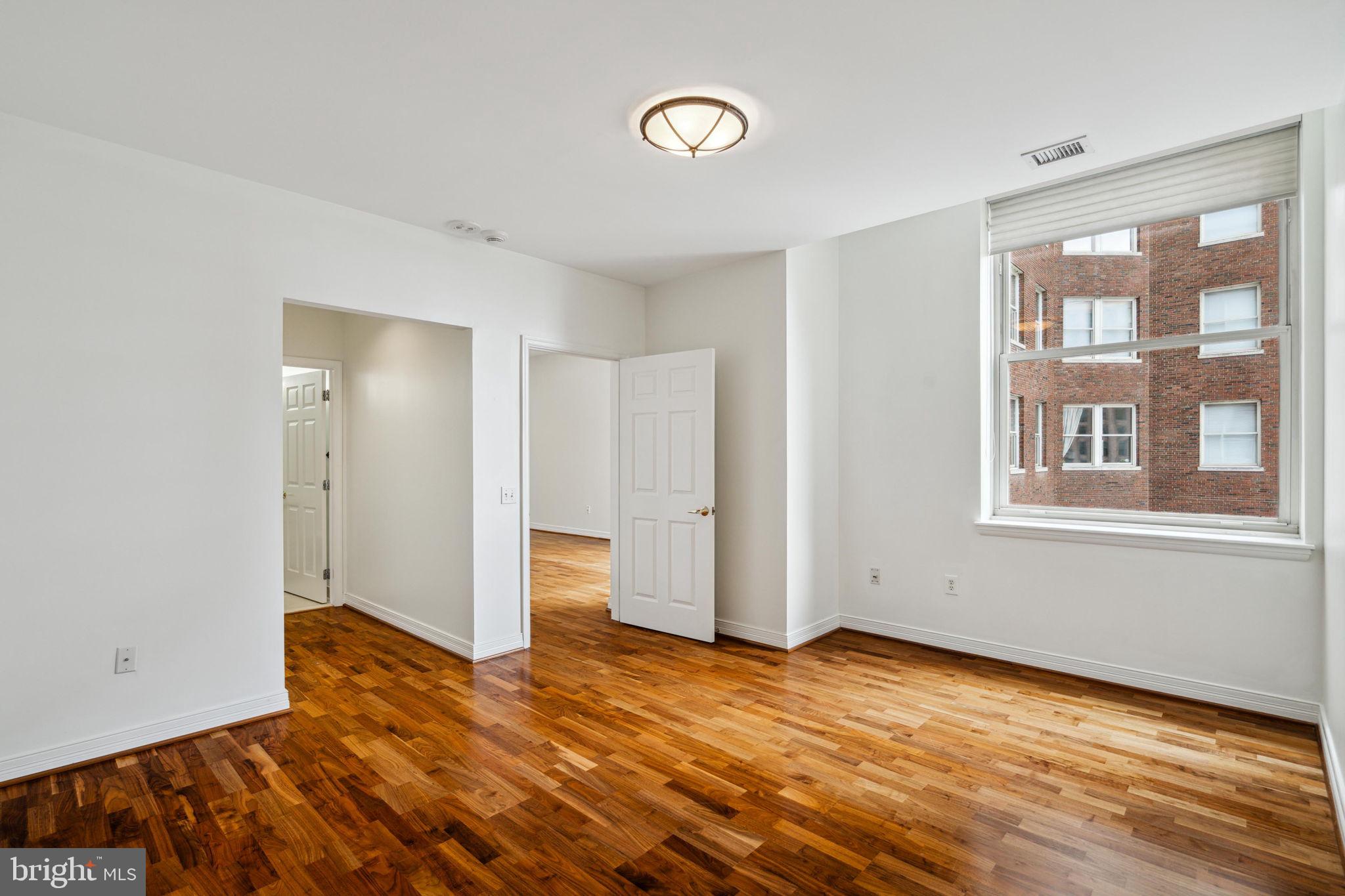 1600 Arch Street, Unit 1113 Philadelphia, PA 19103 - Photo 15 of 34 a view of empty room with wooden floor and fan