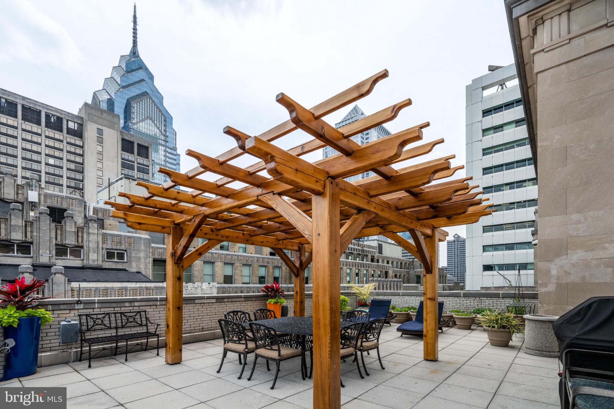 1600 Arch Street, Unit 1113 Philadelphia, PA 19103 - Photo 27 of 34 a building outdoor space with patio furniture and potted plants